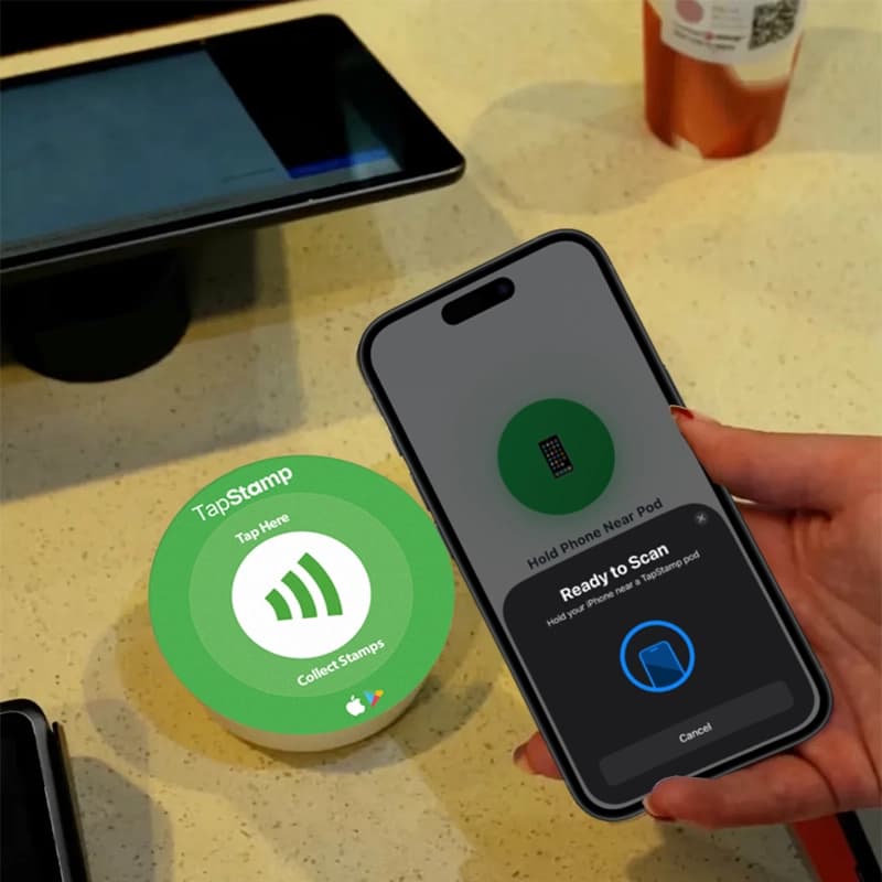 TapStamp NFC pod with phone tapping to collect a stamp